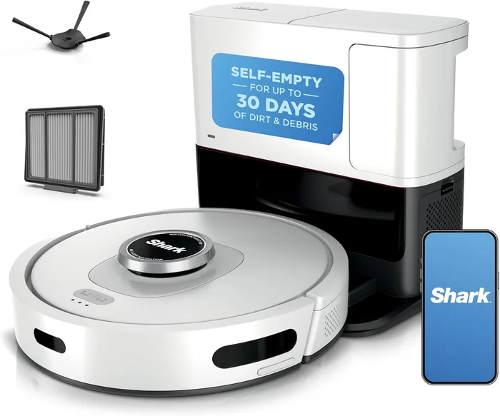 A white robot vacuum with a self-emptying base station and companion phone app.