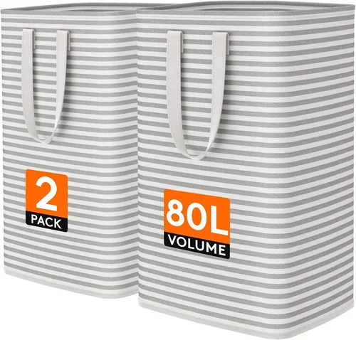 Two tall collapsible laundry hampers with handles, one for dirty clothes and one for clean clothes.