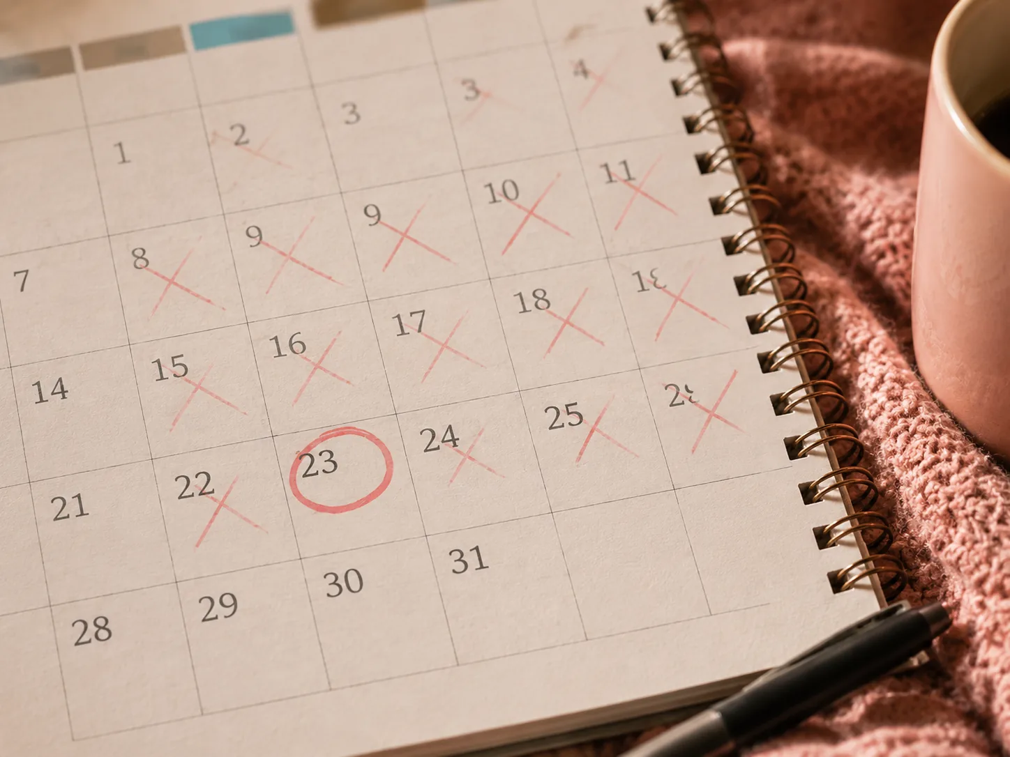 A calendar with missed days marked, representing how broken streaks can trigger shame and avoidance for ADHD brains.